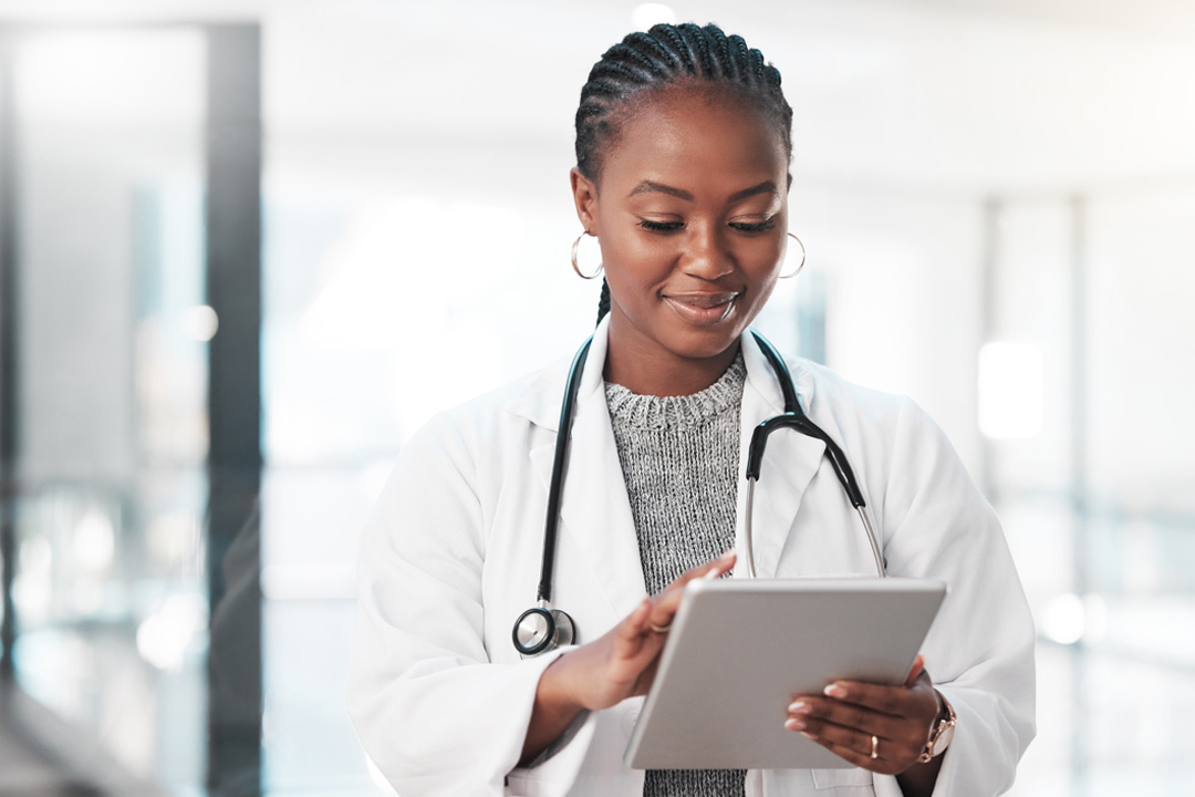 health care provider holding a tablet